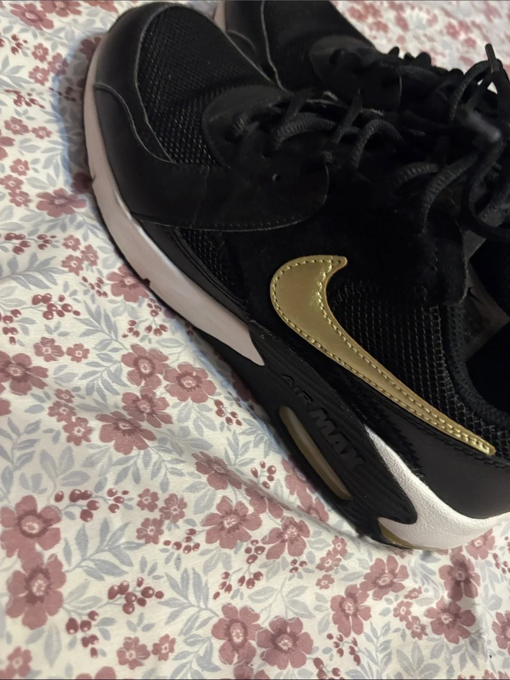 Nike Women's Black Sneakers with Subtle Gold Accent